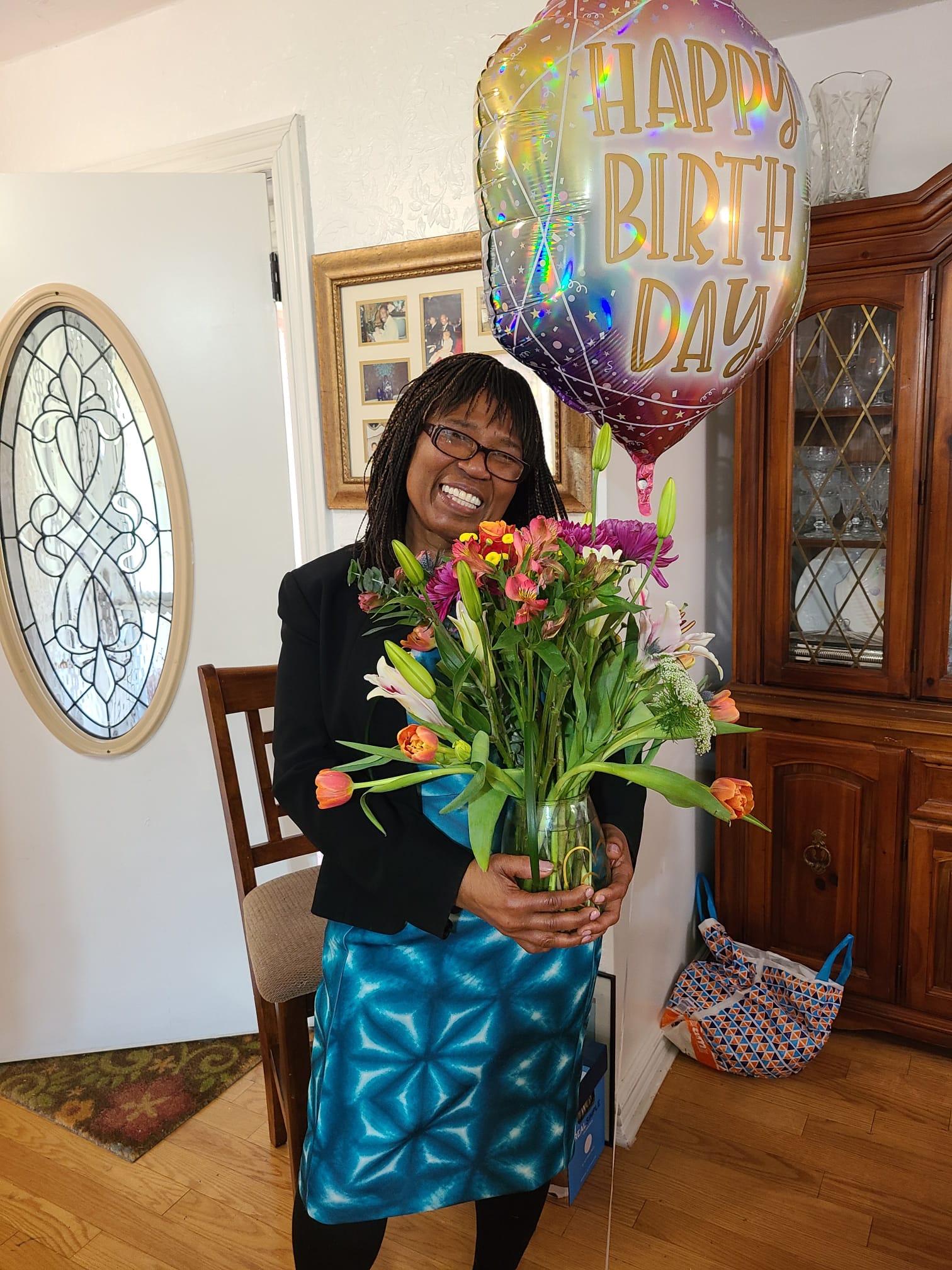 Holding birthday flowers